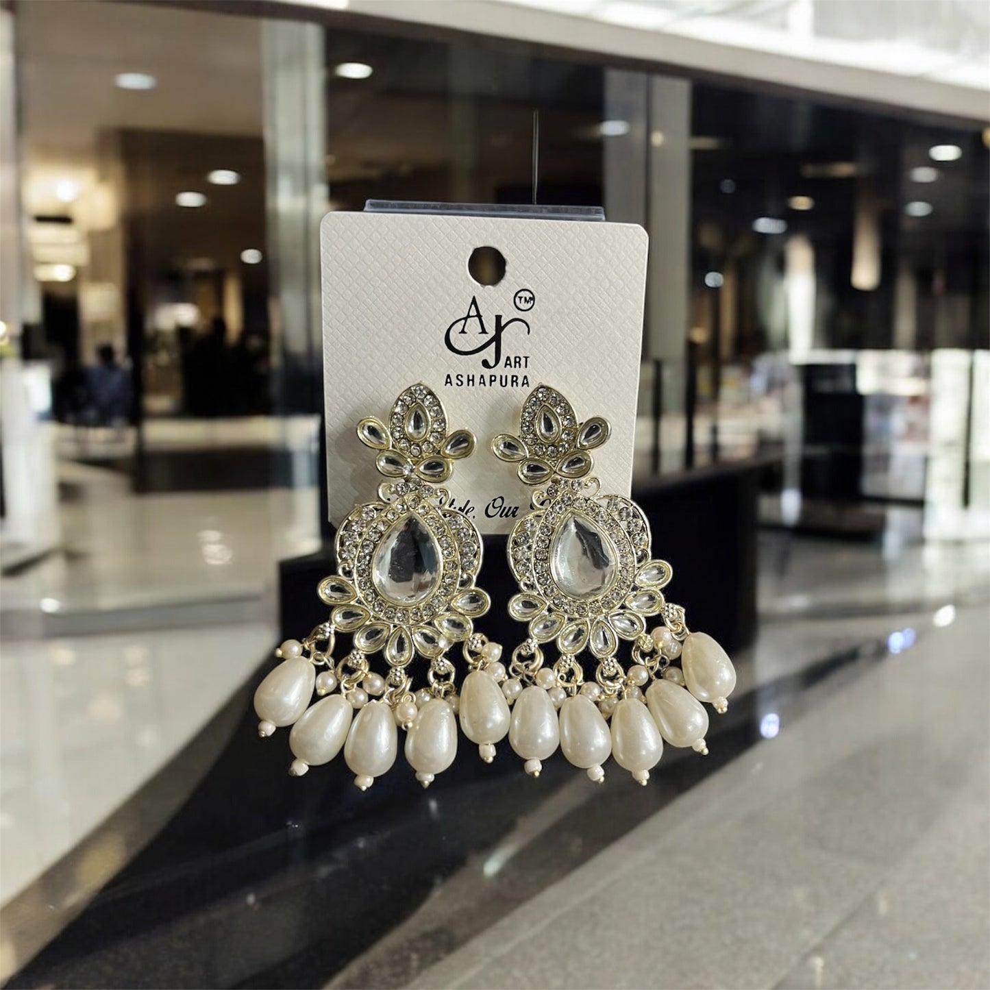 small AJ White fancy earring