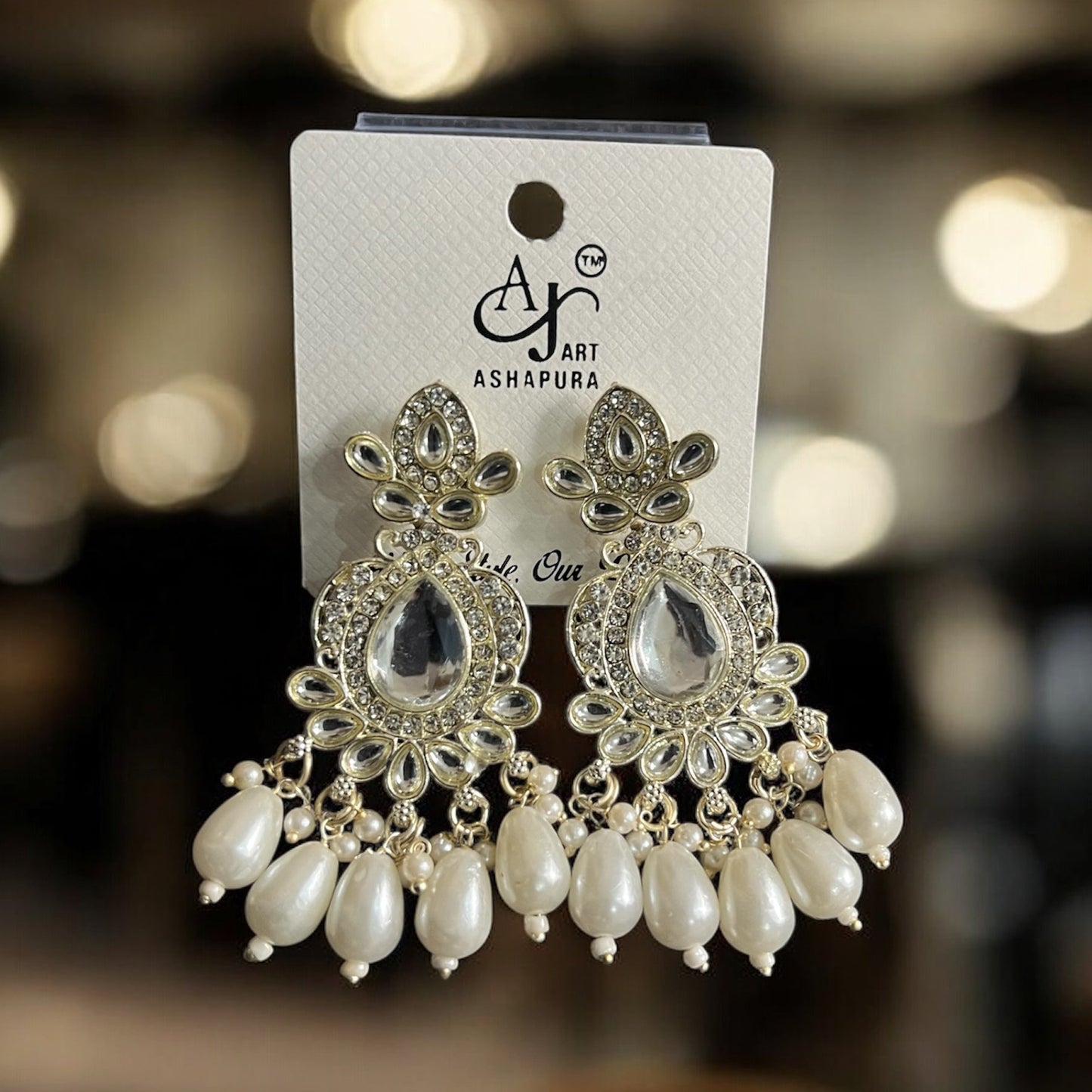 small AJ White fancy earring